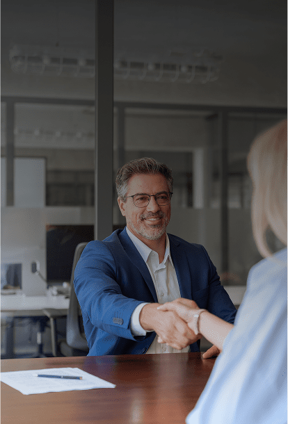 Man in blue suit shaking hands